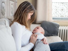 A woman with her baby taking care of a fever in toddlers.
