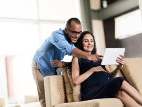 A pregnant couple preparing for parenthood.