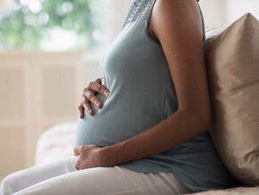 A pregnant woman coping with pregnancy pains.