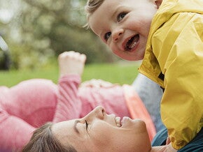 A woman doing a routine for exercise with toddlers.