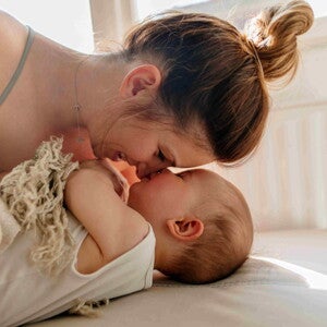 A baby massage can help your child rest and rest better when he sleeps. A mom and her child bonding after a baby massage.