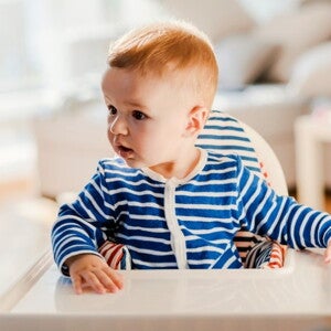 A baby looks at his surroundings during the linguistic stage of language development. A baby looks at his surroundings during the linguistic stage of language development.