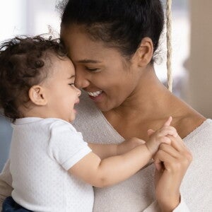 You must pay careful attention to your new mom emotions. A mother holding her baby filled with new mom emotions.