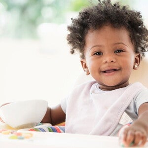 Learn how to help your baby with the most common teething symptoms A child smiling during their teething symptoms