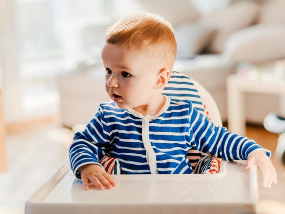 A baby looks at his surroundings during the linguistic stage of language development.