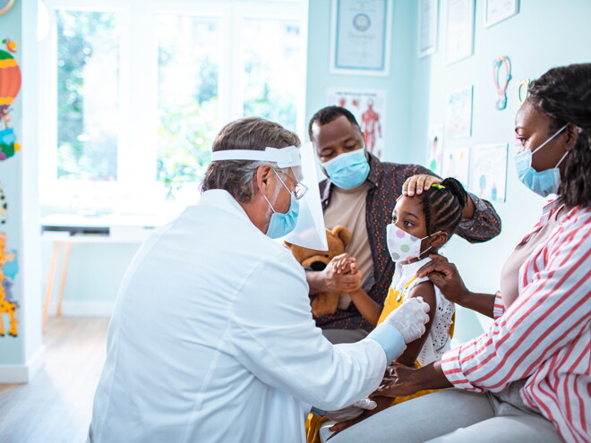 A little girl getting her vaccines and immunization.