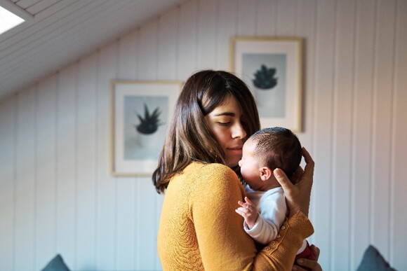 Your baby may show a lot of discomfort as a sign of an ear infection. A mother taking care of her baby during an ear infection.